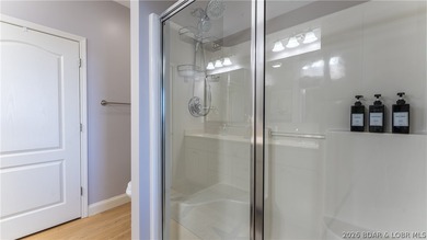 Experience the ultimate lake lifestyle in this impeccably