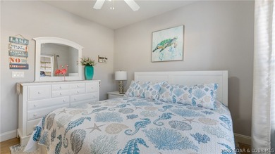 Experience the ultimate lake lifestyle in this impeccably