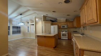 Set on an attractive corner lot, this beautifully maintained - photo 4