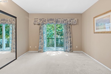 Perched on the top floor of a well-maintained building, this