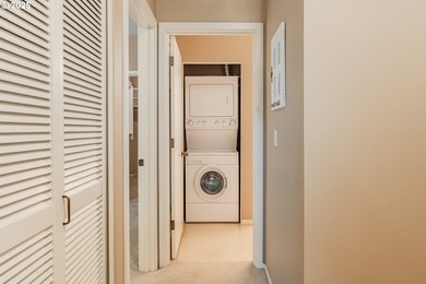 Perched on the top floor of a well-maintained building, this