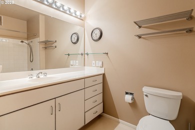 Perched on the top floor of a well-maintained building, this