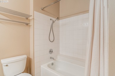 Perched on the top floor of a well-maintained building, this