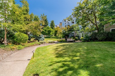 Perched on the top floor of a well-maintained building, this