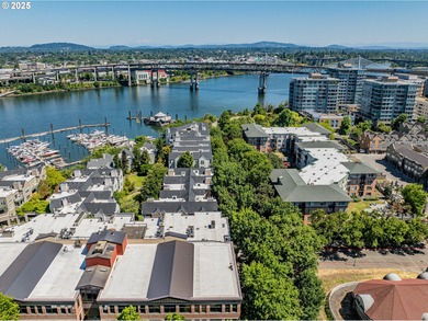 Perched on the top floor of a well-maintained building, this