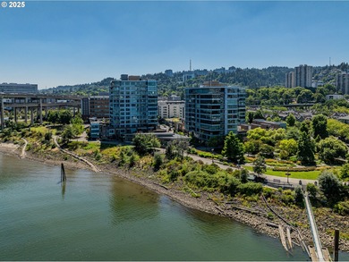 Perched on the top floor of a well-maintained building, this