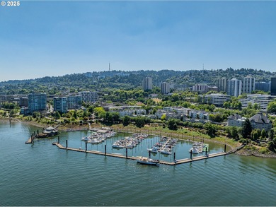 Perched on the top floor of a well-maintained building, this