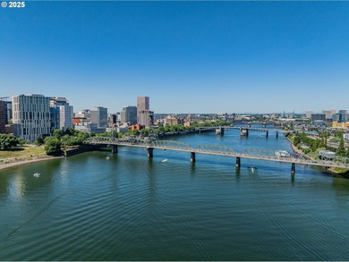 Perched on the top floor of a well-maintained building, this