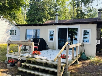 Your Up North LAKEFRONT GETAWAY is waiting! This turn-key - photo 2