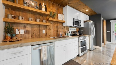 Experience luxury lakefront living on a scale rarely found at - photo 18