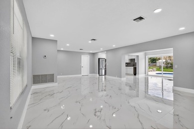 Welcome to this charming single-story residence located in Lake - photo 5