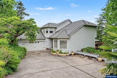 !IMPROVED PRICE! Nestled among the trees, this beautifully - photo 1