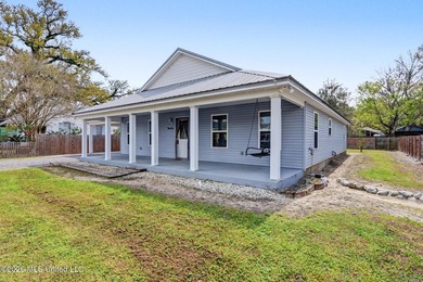 Welcome to coastal living in the heart of Bay St. Louis, located - photo 3
