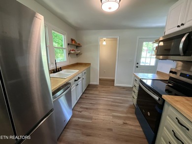 Modern City Living Near the Lake! 3 BR | 2 BA | Fully Updated - photo 2