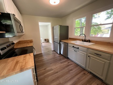 Modern City Living Near the Lake! 3 BR | 2 BA | Fully Updated - photo 6