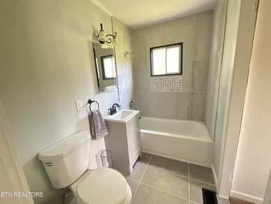 Modern City Living Near the Lake! 3 BR | 2 BA | Fully Updated - photo 9