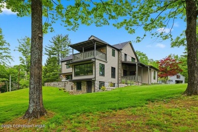 This elegant home is beautifully nestled on 1.5 acres high on - photo 3