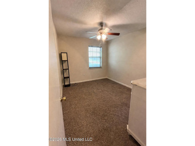 This well-maintained brick home offers a functional layout with - photo 2