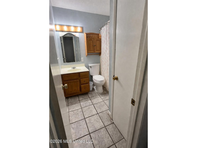 This well-maintained brick home offers a functional layout with - photo 3
