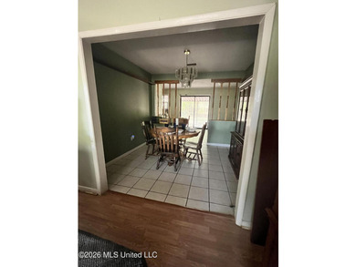 This well-maintained brick home offers a functional layout with - photo 4