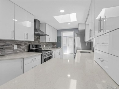 Welcome to this fully renovated ranch-style residence in the - photo 11