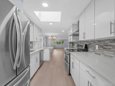 Welcome to this fully renovated ranch-style residence in the - photo 12
