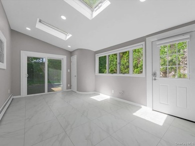 Welcome to this fully renovated ranch-style residence in the - photo 13
