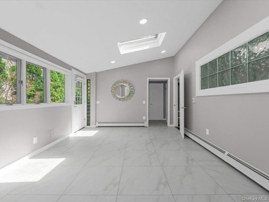Welcome to this fully renovated ranch-style residence in the - photo 14