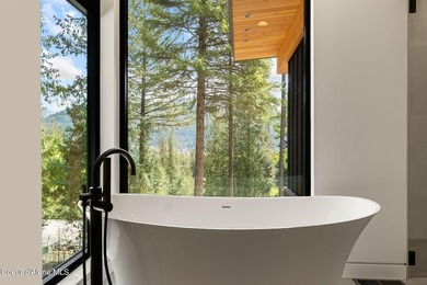 Stunning custom home with sweeping treetop and mountain views - photo 42