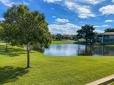 Welcome to this charming two-bedroom, two-bathroom condominium - photo 1