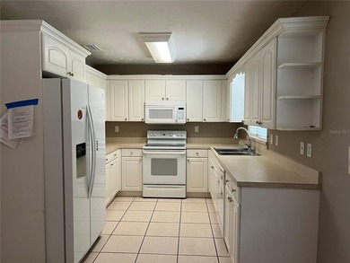 Welcome home to this charming 4-bedroom, 2-bath concrete block - photo 7
