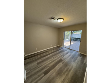 Welcome to this charming three-bedroom, three-bathroom townhouse - photo 13
