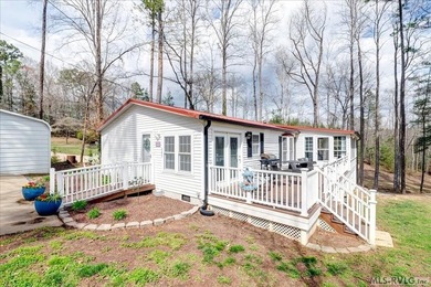 Effortless lakefront living meets income potential--welcome to