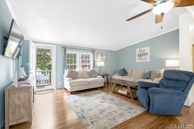 Effortless lakefront living meets income potential--welcome to