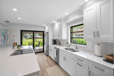 Enjoy tranquil golf and lake views from this beautifully - photo 8
