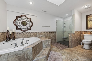 This 5-bedroom, 3.5-bath lakefront home in Four Seasons is - photo 30