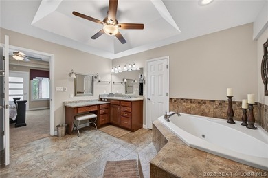 This 5-bedroom, 3.5-bath lakefront home in Four Seasons is - photo 32