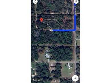 This vacant 0.55-acre corner lot, located near a scenic lake and - photo 5