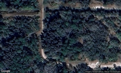 This vacant 0.55-acre corner lot, located near a scenic lake and - photo 7