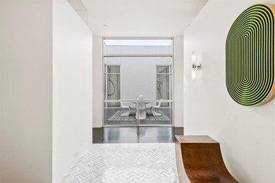 Welcome to Art House Unit 3C, a top-floor, luxury condo designed