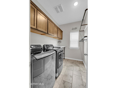 Step into a true open-concept layout where the kitchen, dining