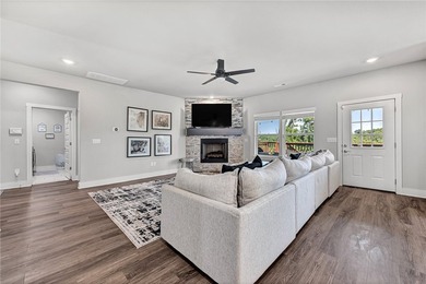 Tucked into the wooded hills of Bella Vista, this home delivers - photo 2