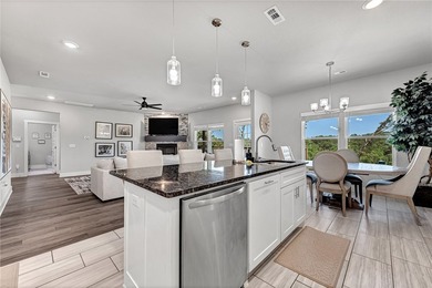 Tucked into the wooded hills of Bella Vista, this home delivers - photo 4