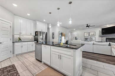 Tucked into the wooded hills of Bella Vista, this home delivers - photo 5