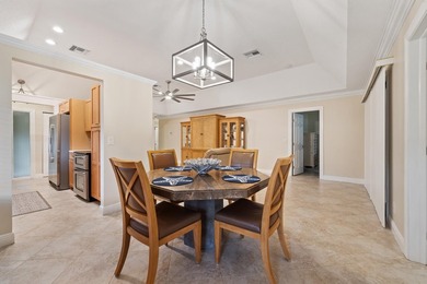 Welcome to this charming corner unit three-bedroom, two-bathroom - photo 2