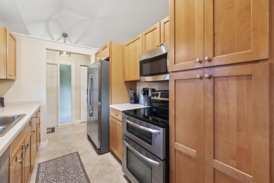 Welcome to this charming corner unit three-bedroom, two-bathroom - photo 6