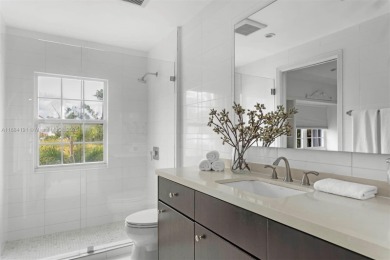 Live the waterfront lifestyle in this elegant townhouse