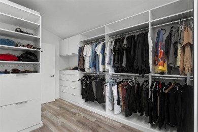 Live the waterfront lifestyle in this elegant townhouse