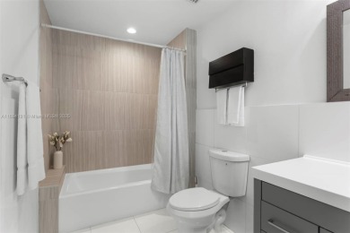 Live the waterfront lifestyle in this elegant townhouse