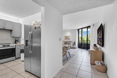 Discover one of Key Colony's most coveted floor plans in the - photo 2